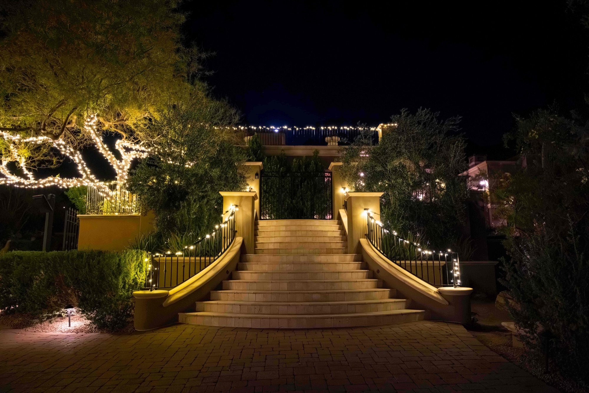 Lit entry staircase and gate at a DC Ranch estate