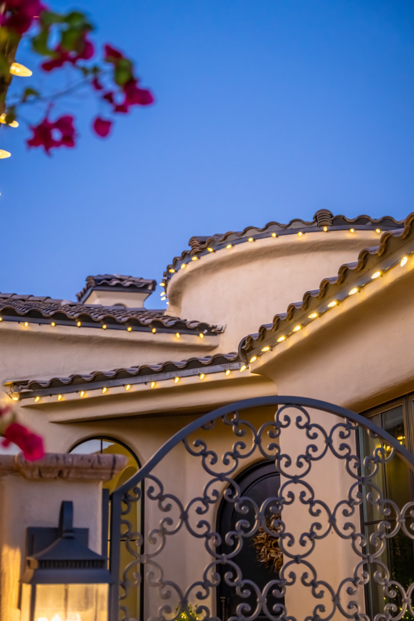 Warm-white roofline lighting on a Paradise Valley home at dusk